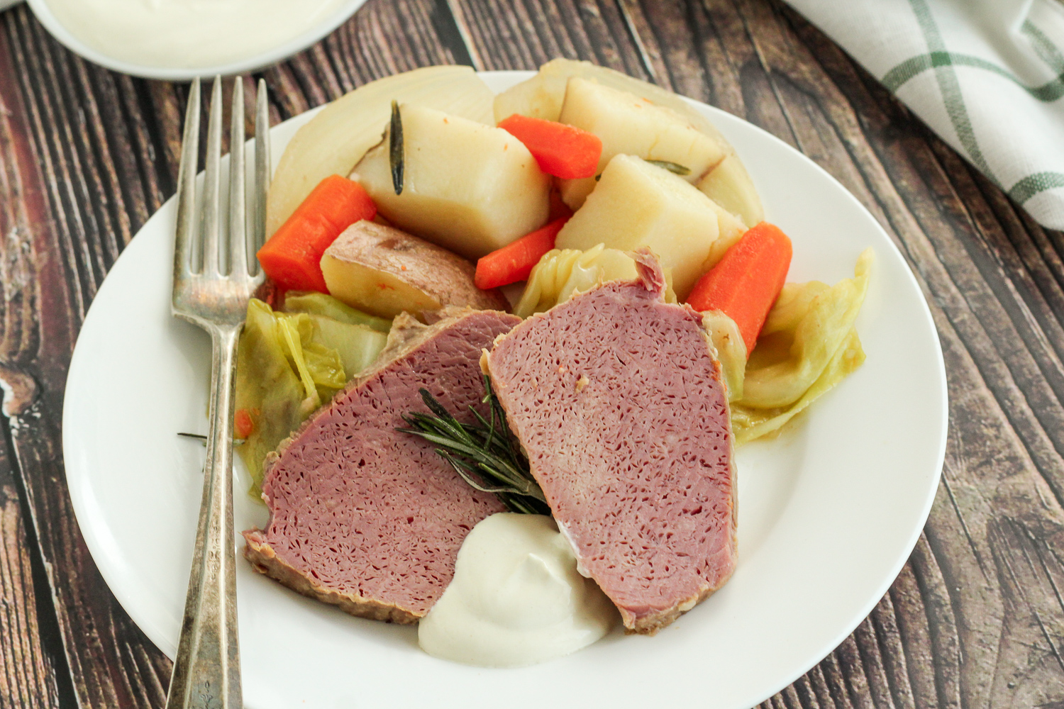 Plate of dutch oven corned beef and cabbage.