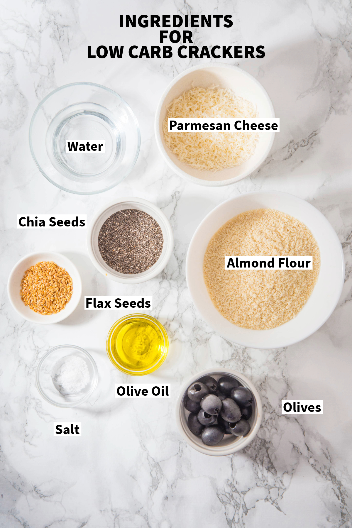 Top view of ingredients on marble slab to make homemade crackers.