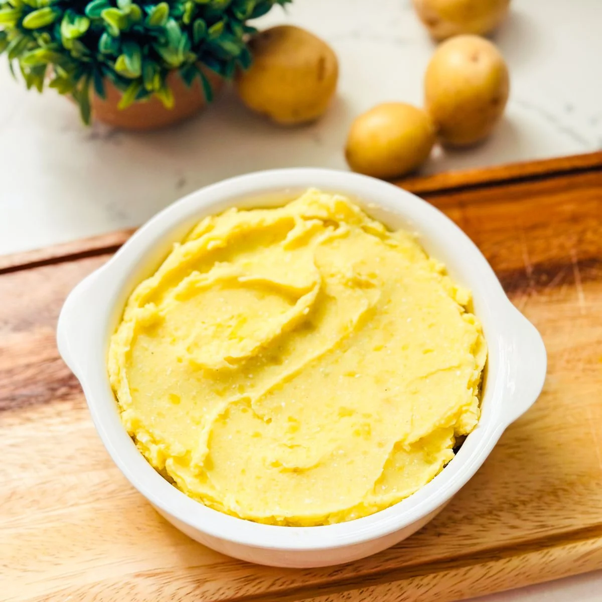 Bowl full of mashed potatoes.