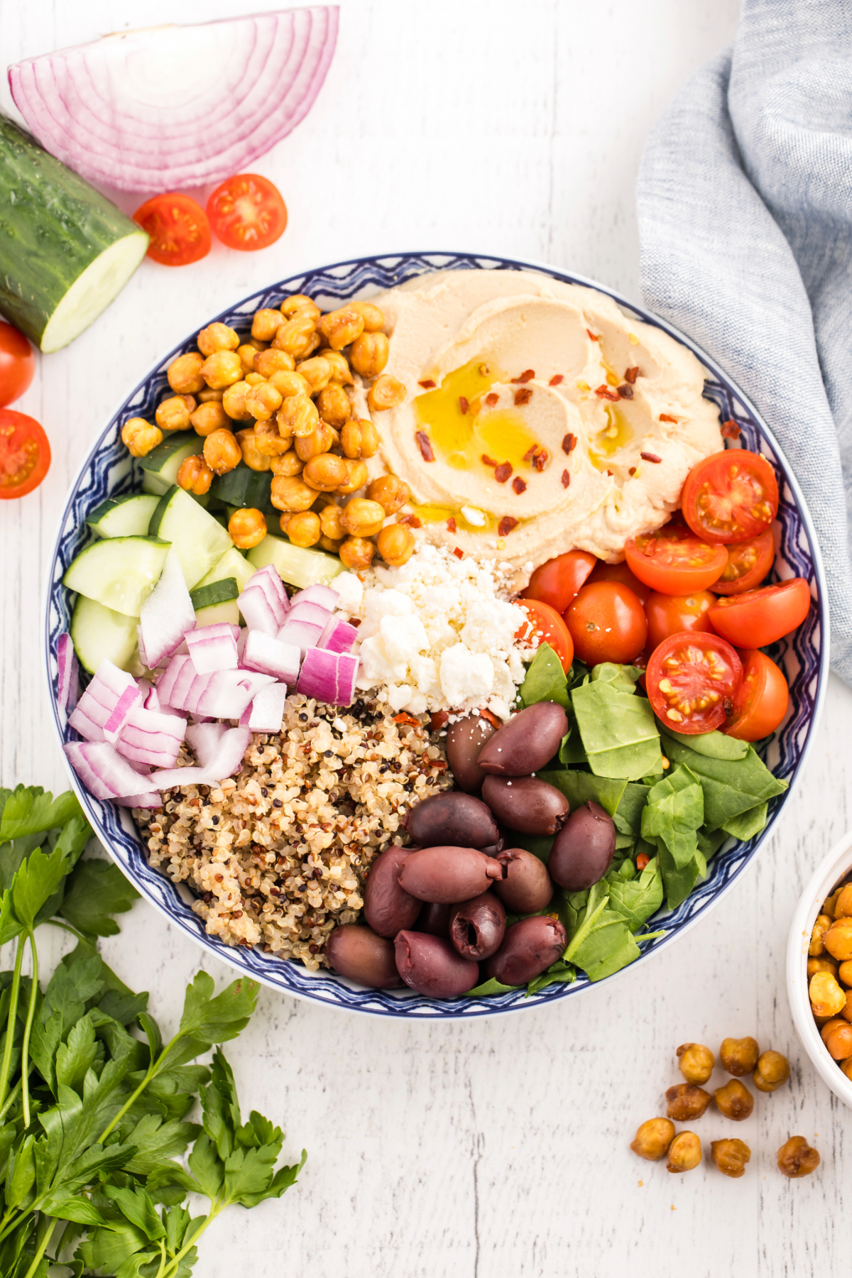 Overhead view of a complete Mediterranean salad bowl.