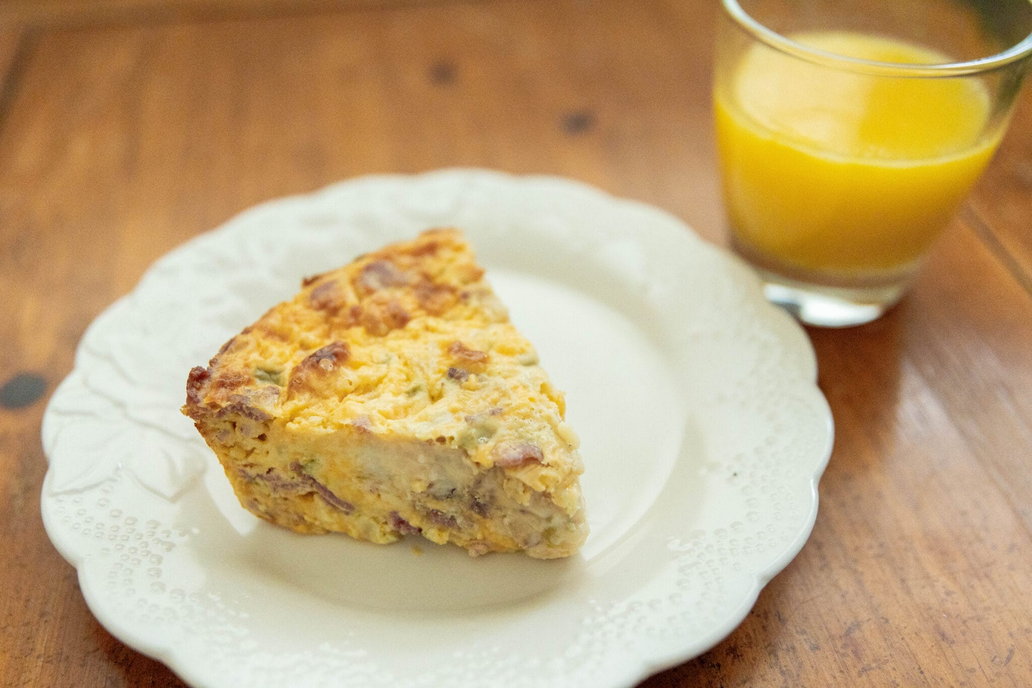 Slice ofegg casserole on a plate.