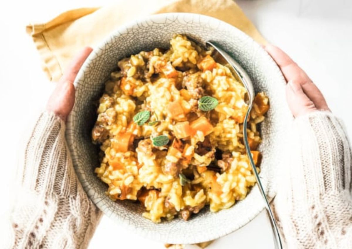 Gray bowl filled with butternut risotto.