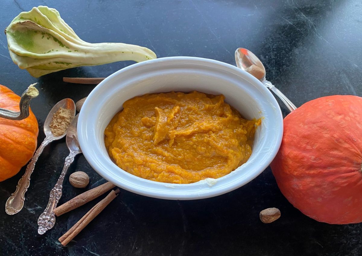 White baking dish full of butternut squash casserole.