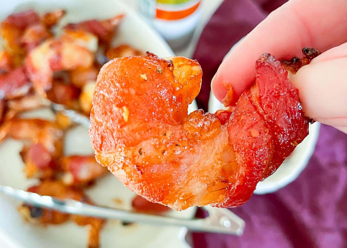 A plate of bacon wrapped mini peppers.