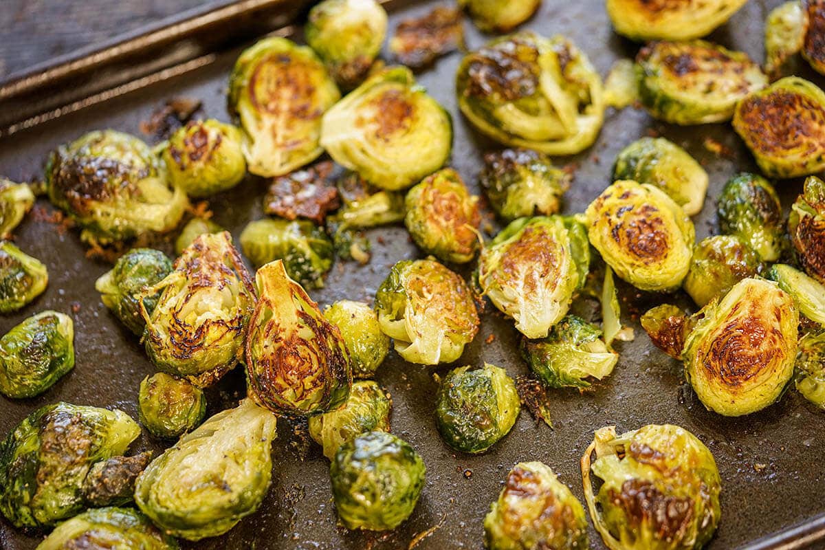 Roasted brussels sprouts on a bkaing sheet. 