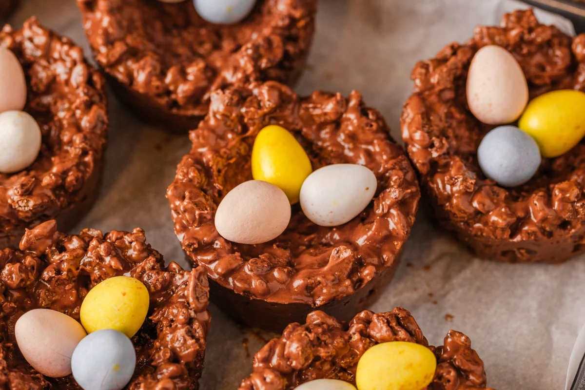Chocolate nests topped with candy eggs.