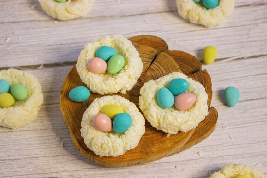 Coconut nests on a wooden cutting board.
