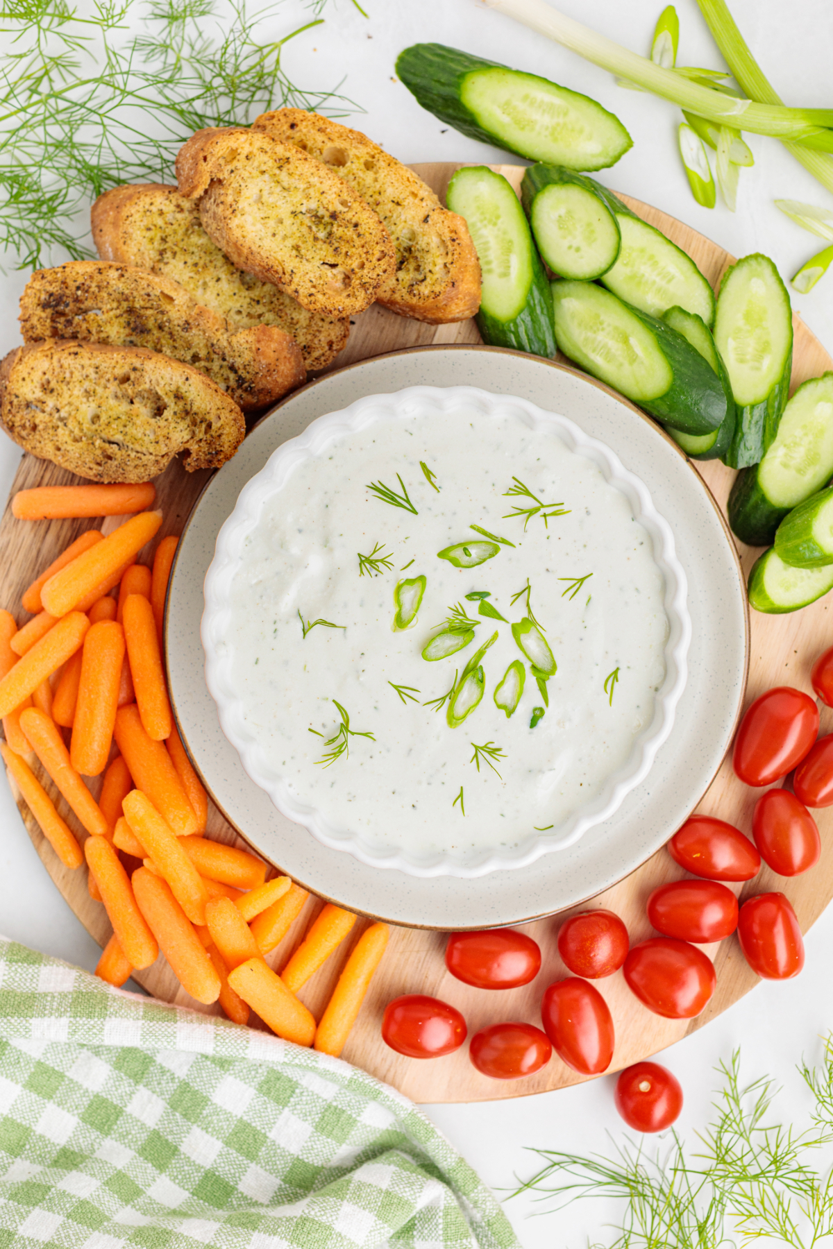 Overhead view of a dip surrounded with vegetables.