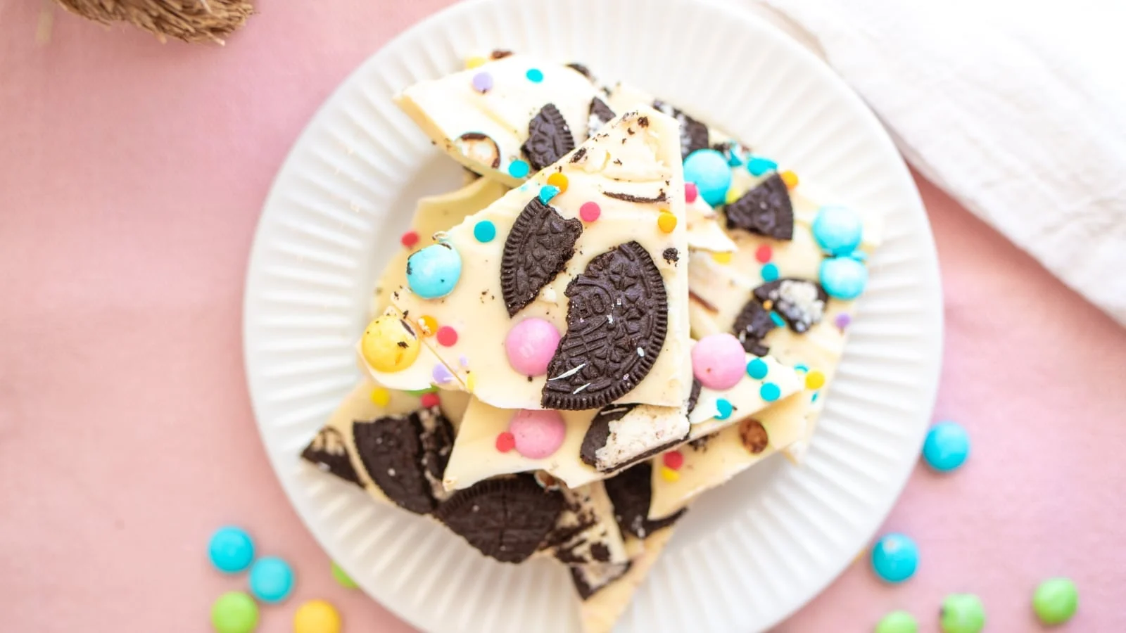 Pieces of Oreo bark on a plate.