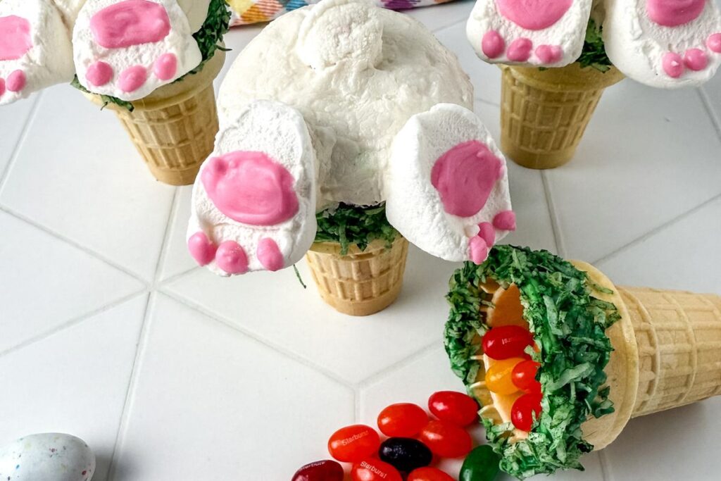 Cupcakes in ice cream cones decorated like bunny butts.