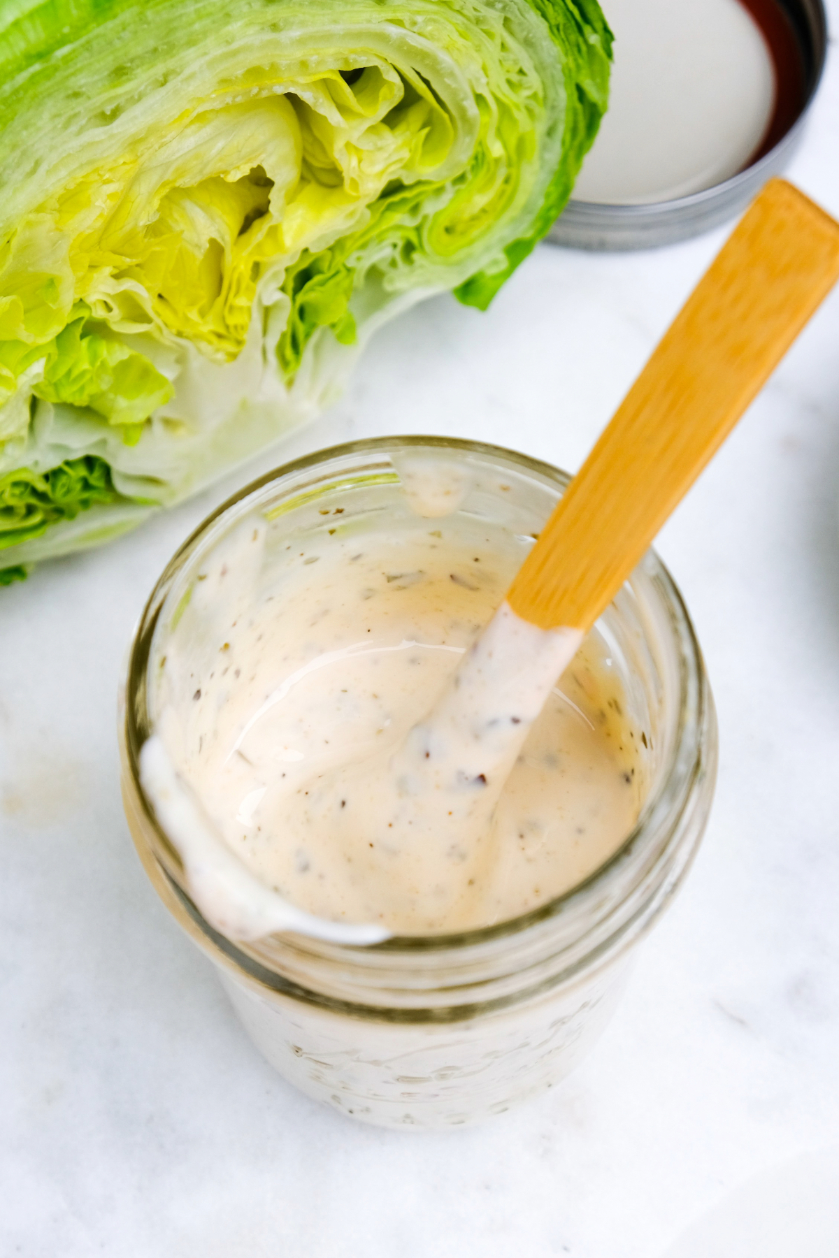 Homemade grinder salad dressing in a mason jar.
