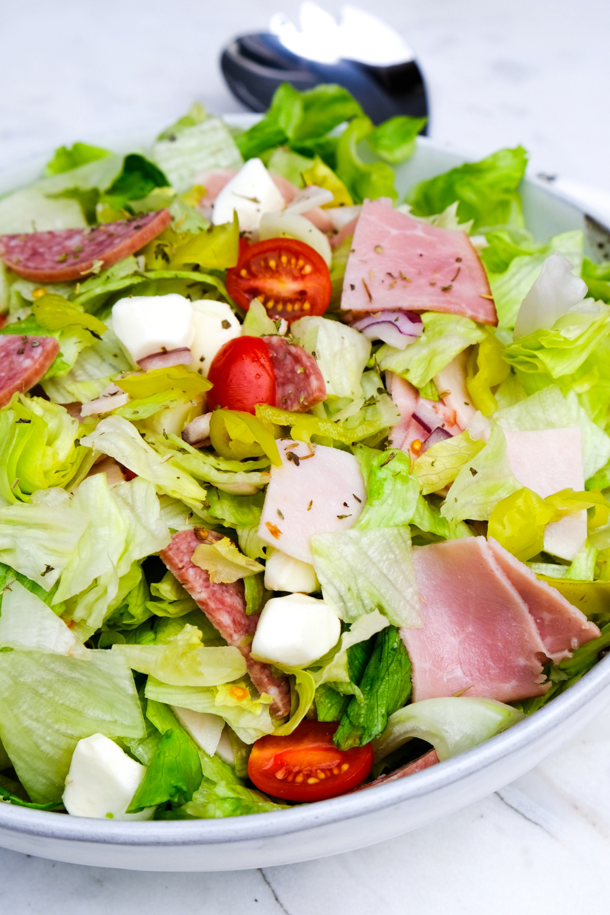 All salad ingredients in a bowl before adding dressing.