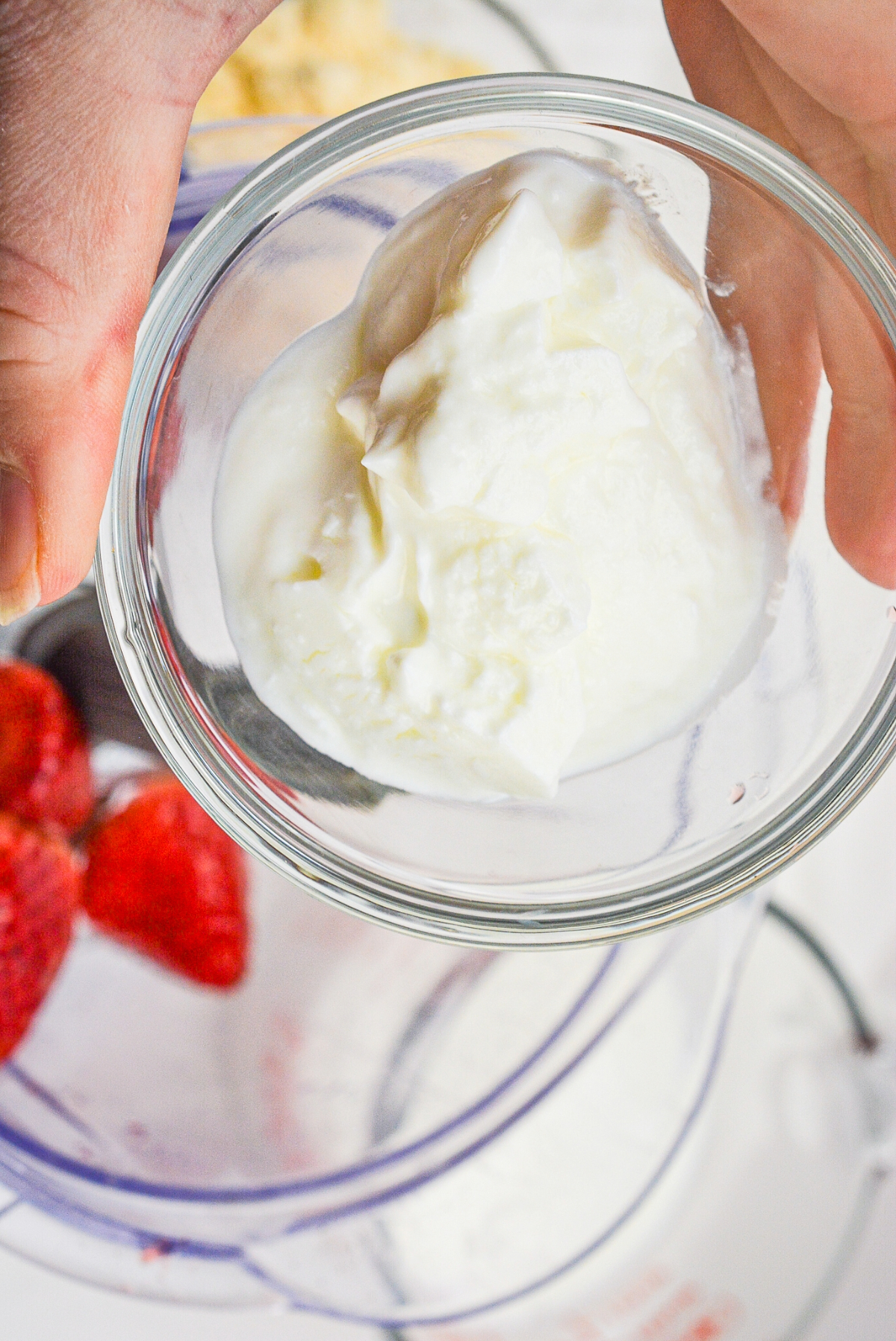 Greek yogurt in a small bowl before adding it to a smoothie mix.