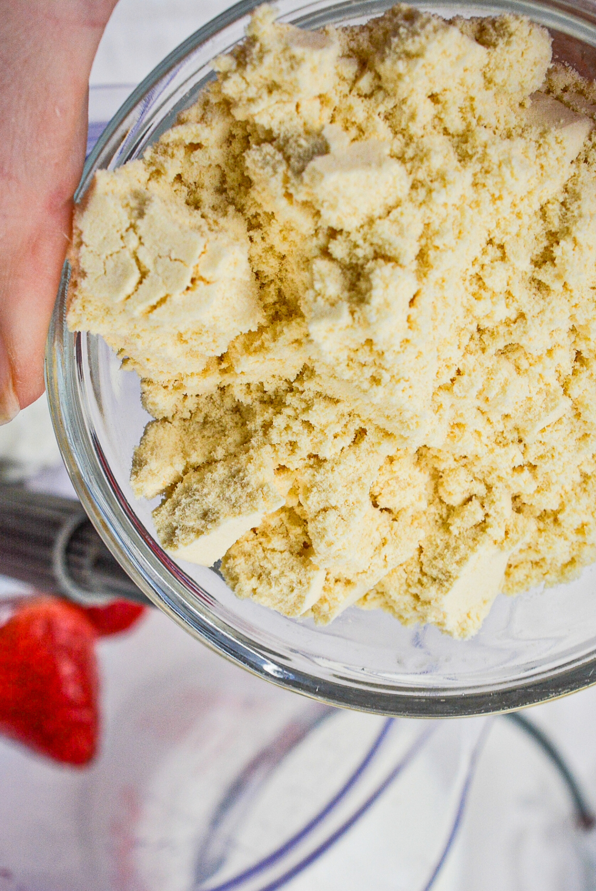 Protein powder in a small bowl before adding to a smoothie mix.