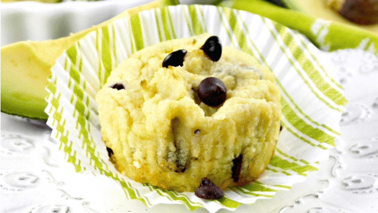 Avocado muffins with chocolate chips on a table.