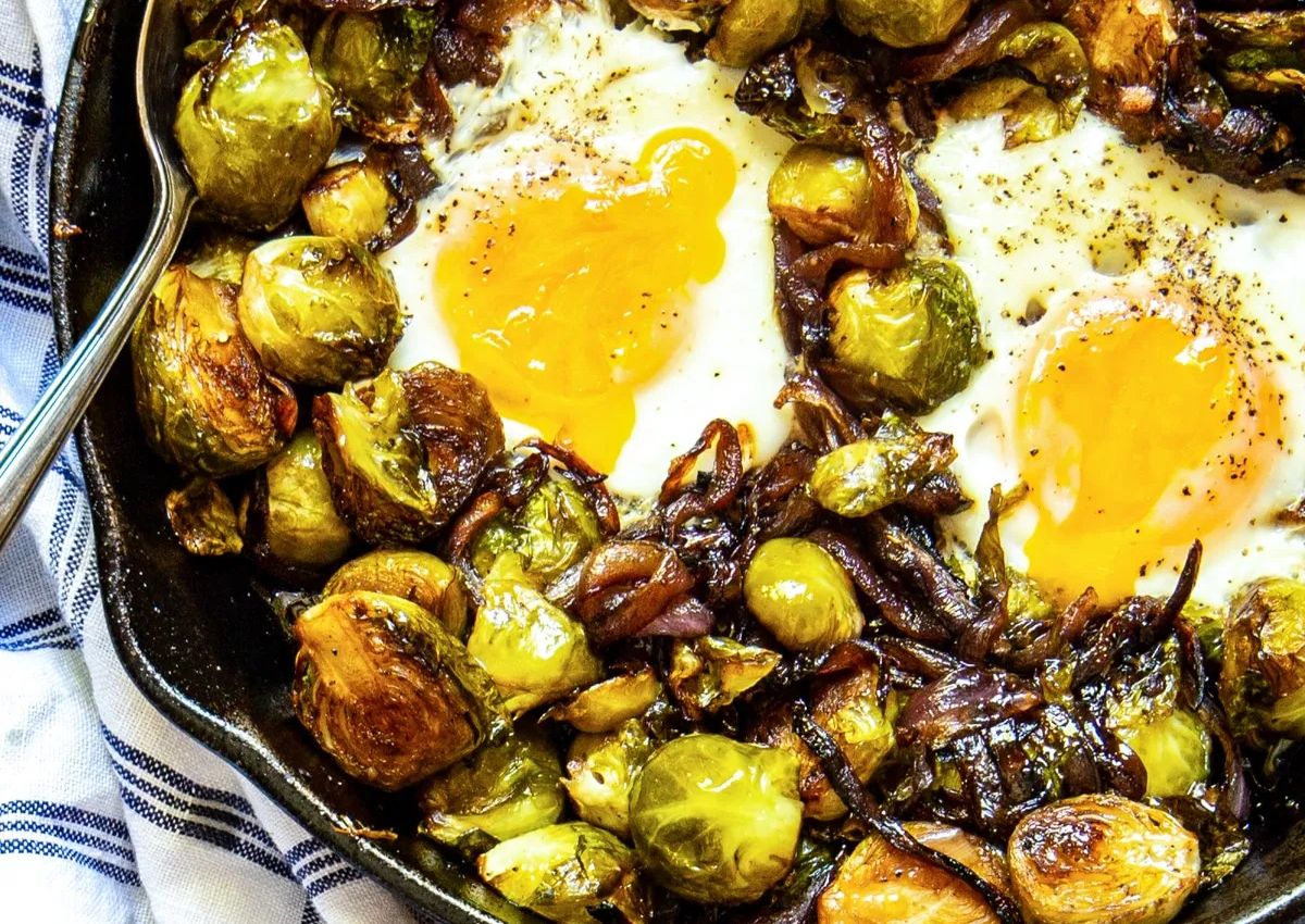 Brussels sprouts and eggs in a cast iron skillet. 