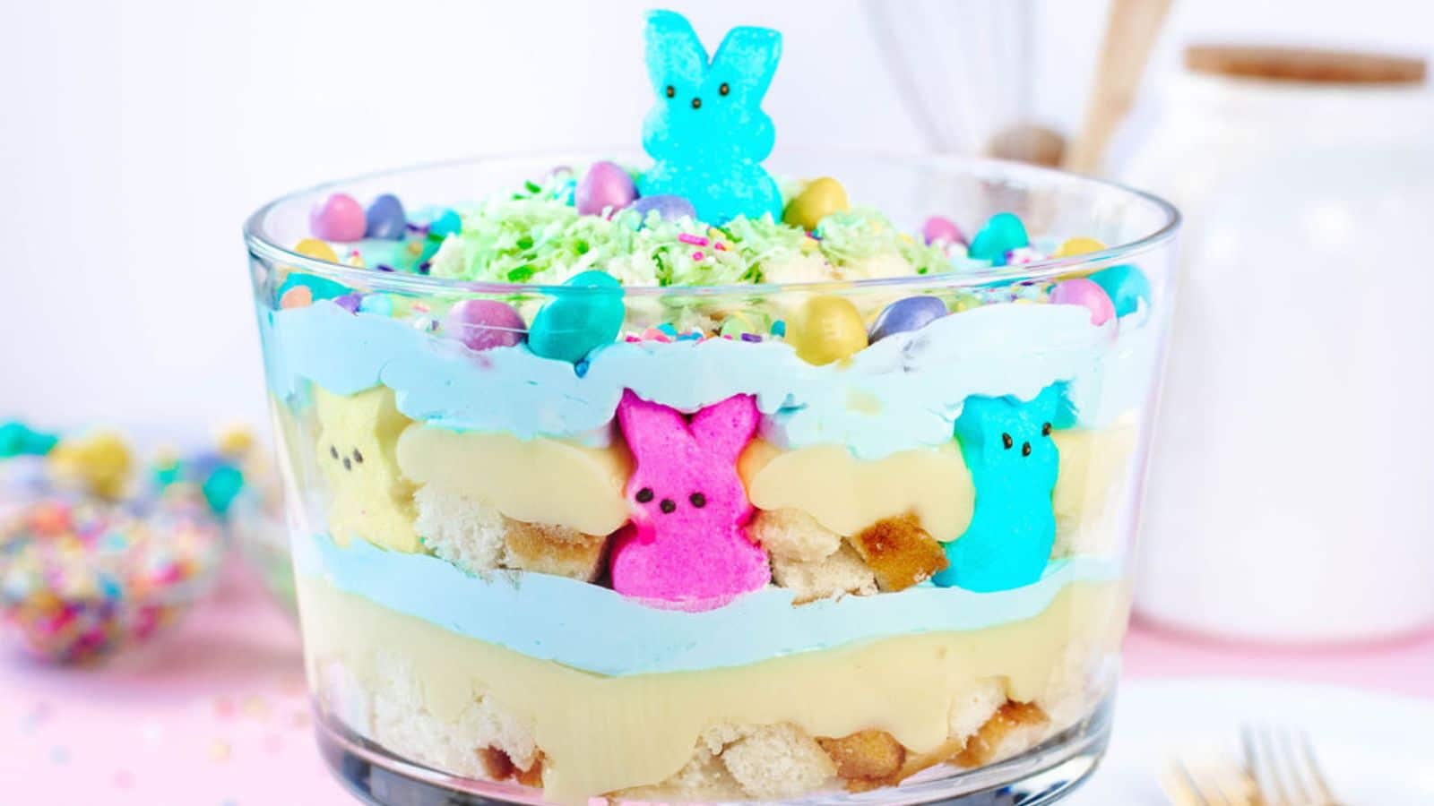 Large trifle bowl with layers of cake and pudding.