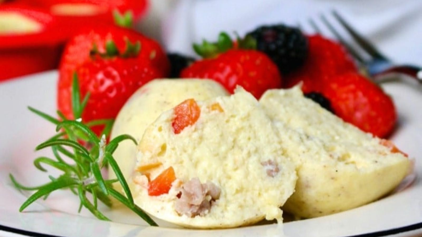 Instant pot egg bites on a plate with fresh berries. 