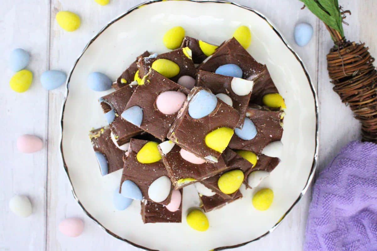 Pieces of mini egg fudge on a plate.