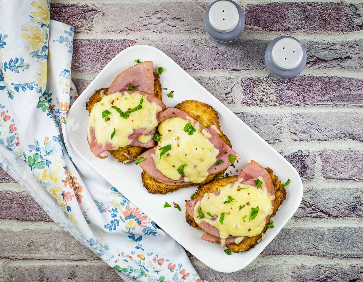 Poor mans chicken cordon bleu on a white plate.