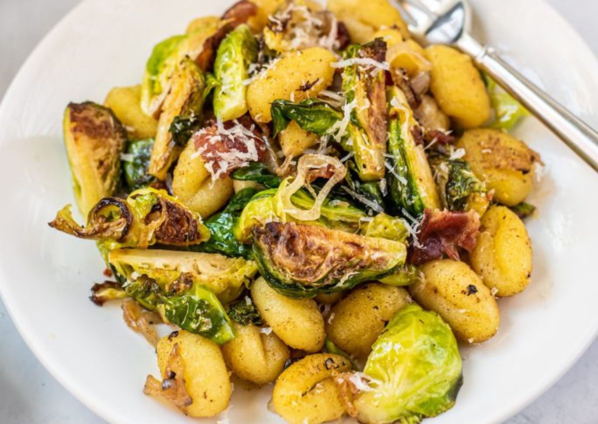 Serving of skillet gnocchi on a plate with a fork. 