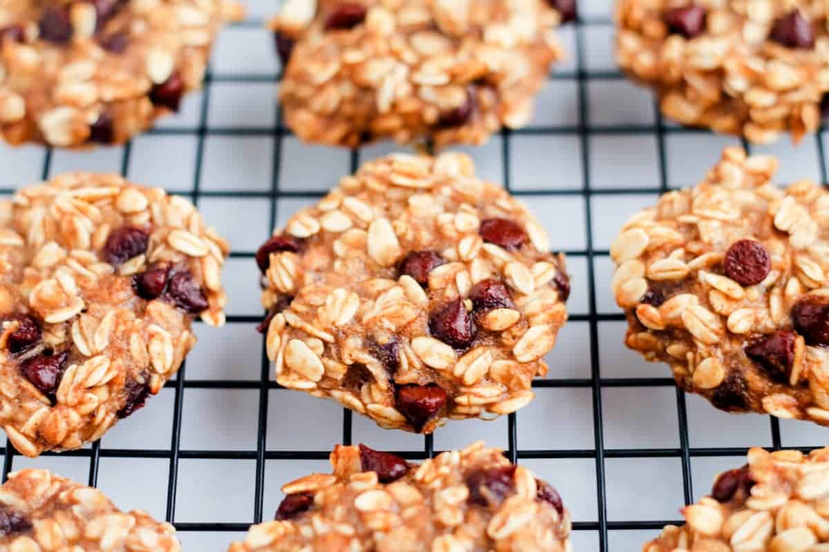 Oatmeal cookies on a wire rack.