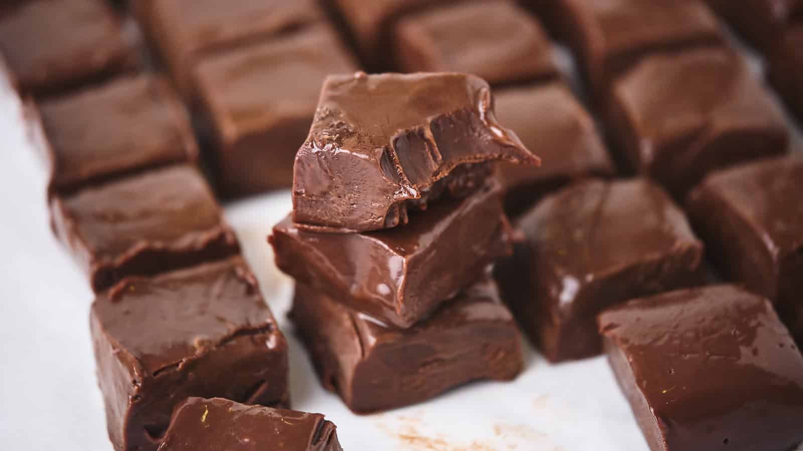 Fudge stacked on a white backdrop.