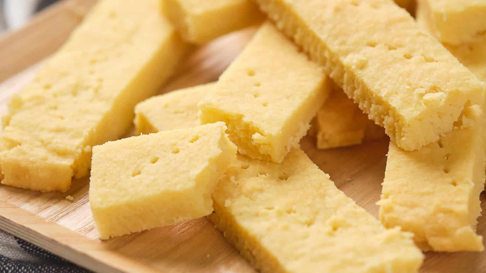 Shortbread cookies on a wooden cutting board.