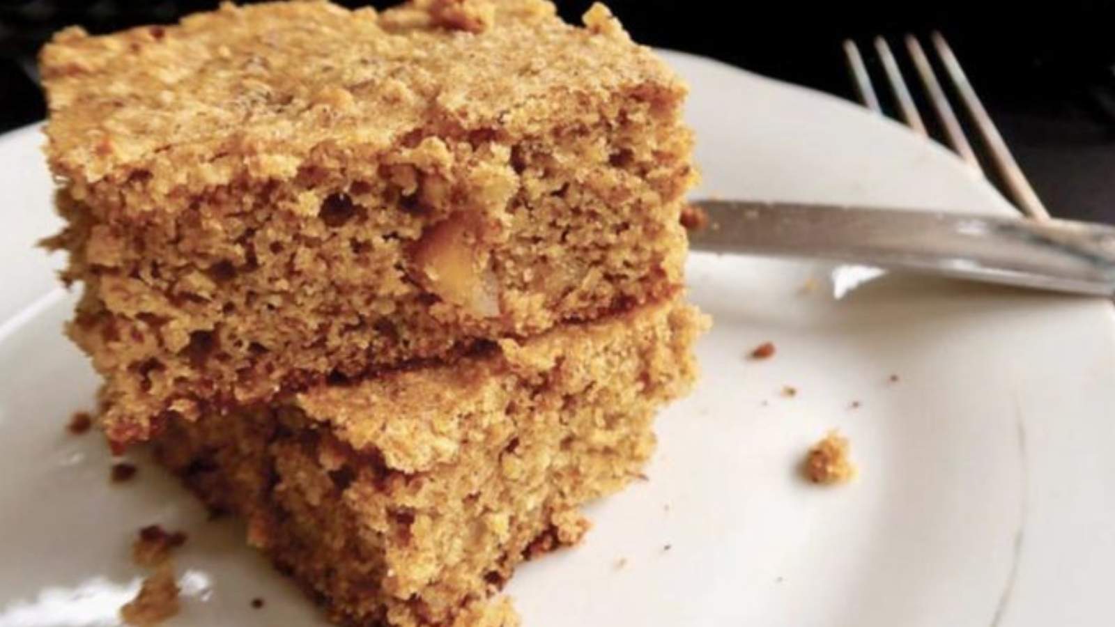 Two slices of low carb coffee cake on a white plate.