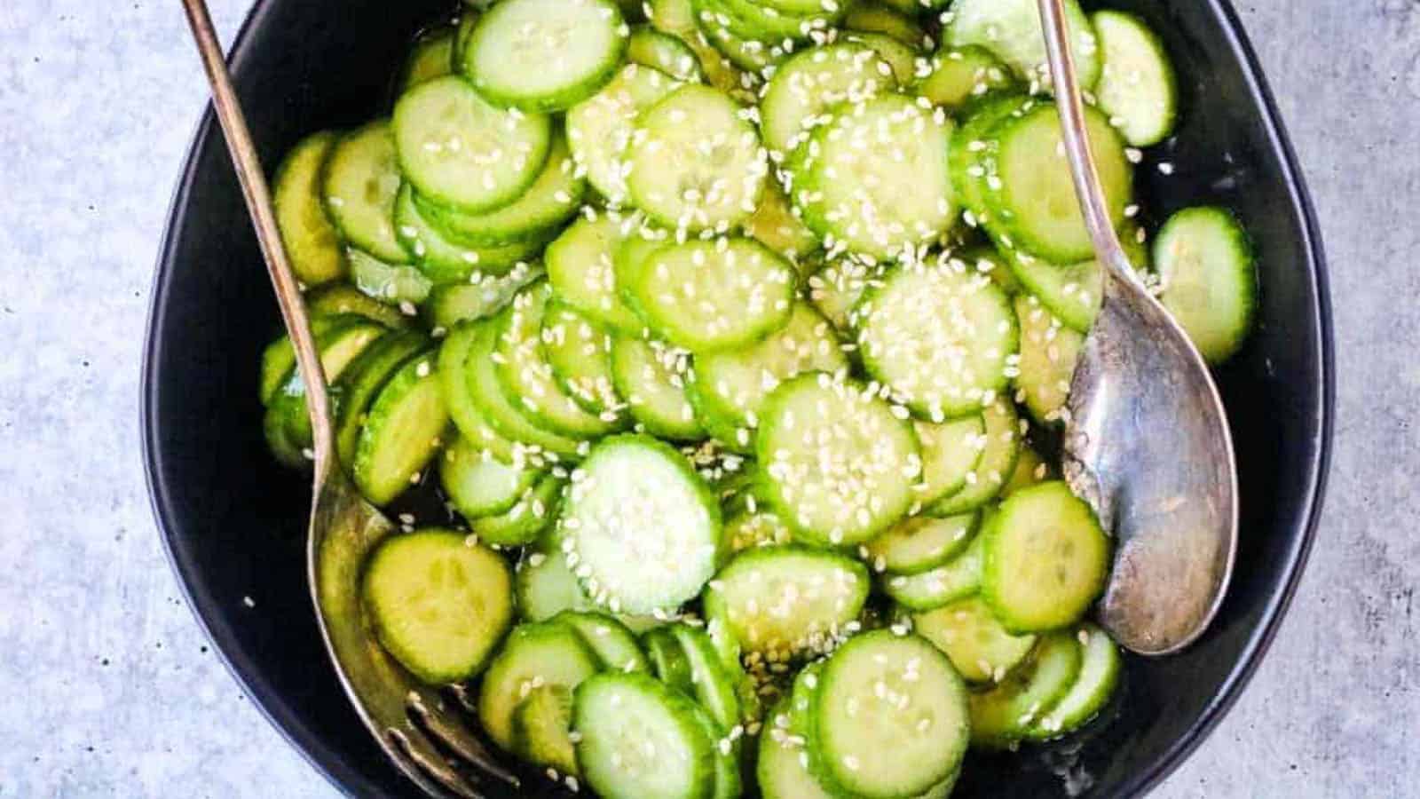 Cucumber Salad in a black bowl.