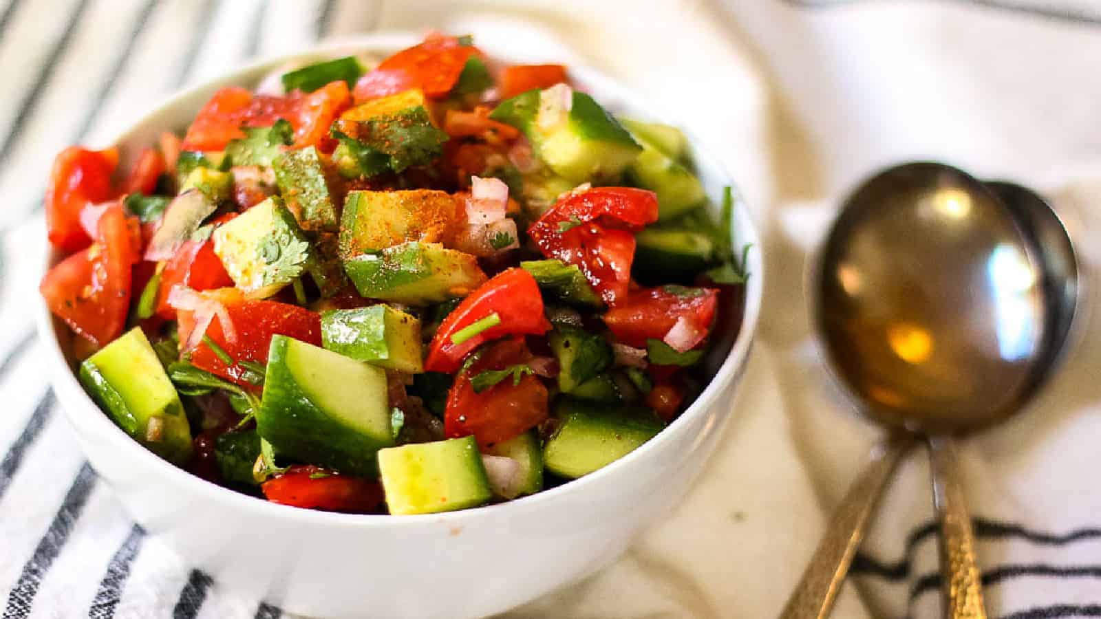 White bowl full of kachumber salad.