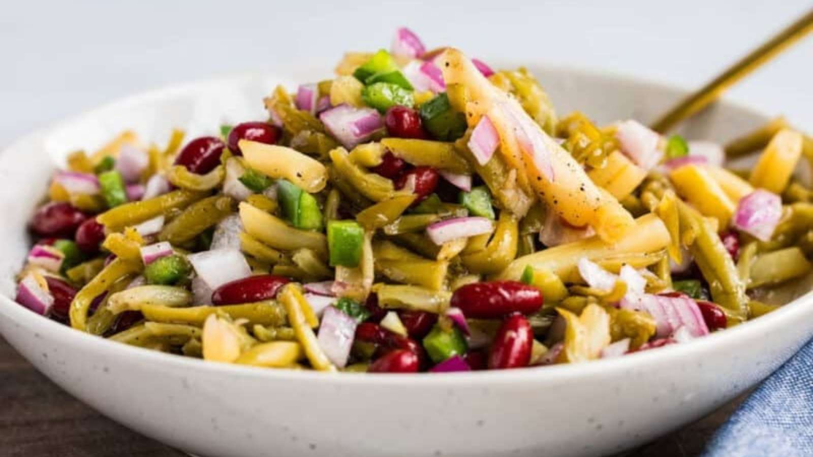 White bowl of old fashioned three bean salad.
