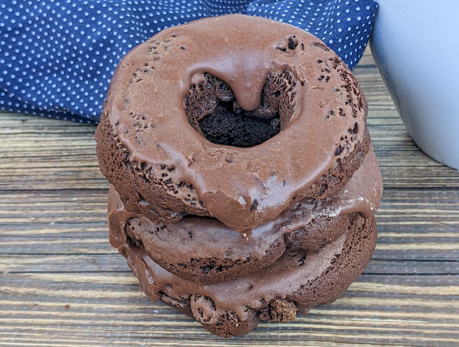 Three peanut butter chocolate donuts.