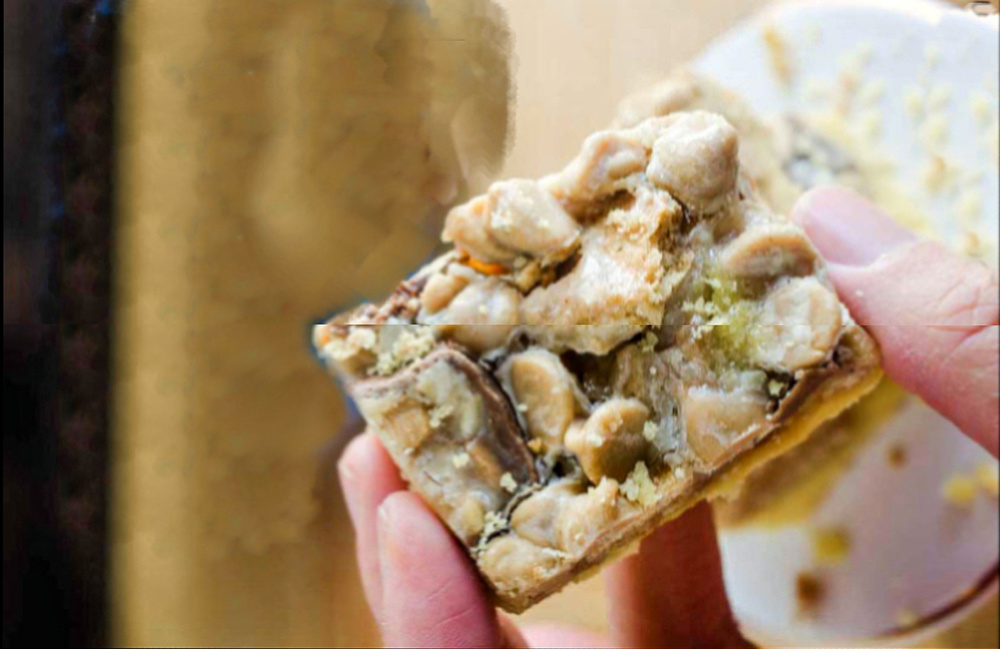 Peanut butter square in a woman's hand,