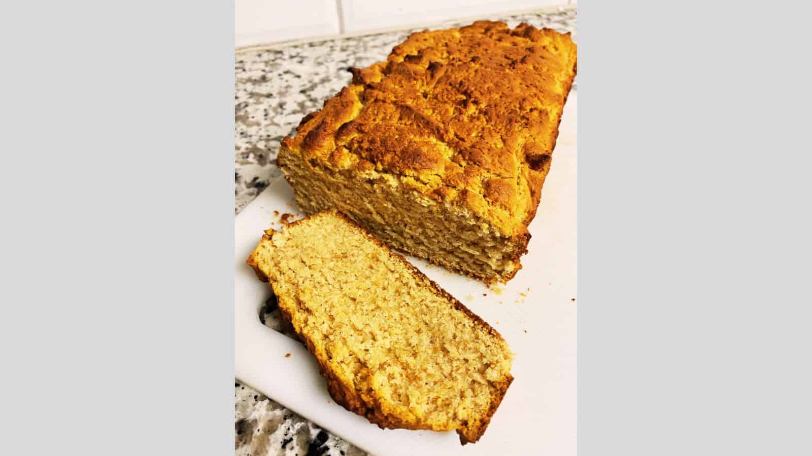 Slice of peanut butter bread on a cutting board.
