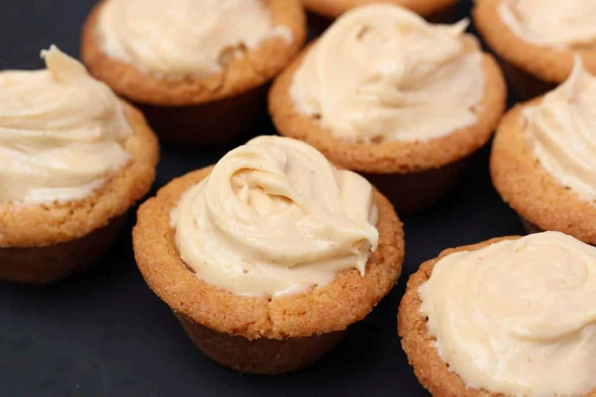 Peanut butter cookie cups on a black backdrop.