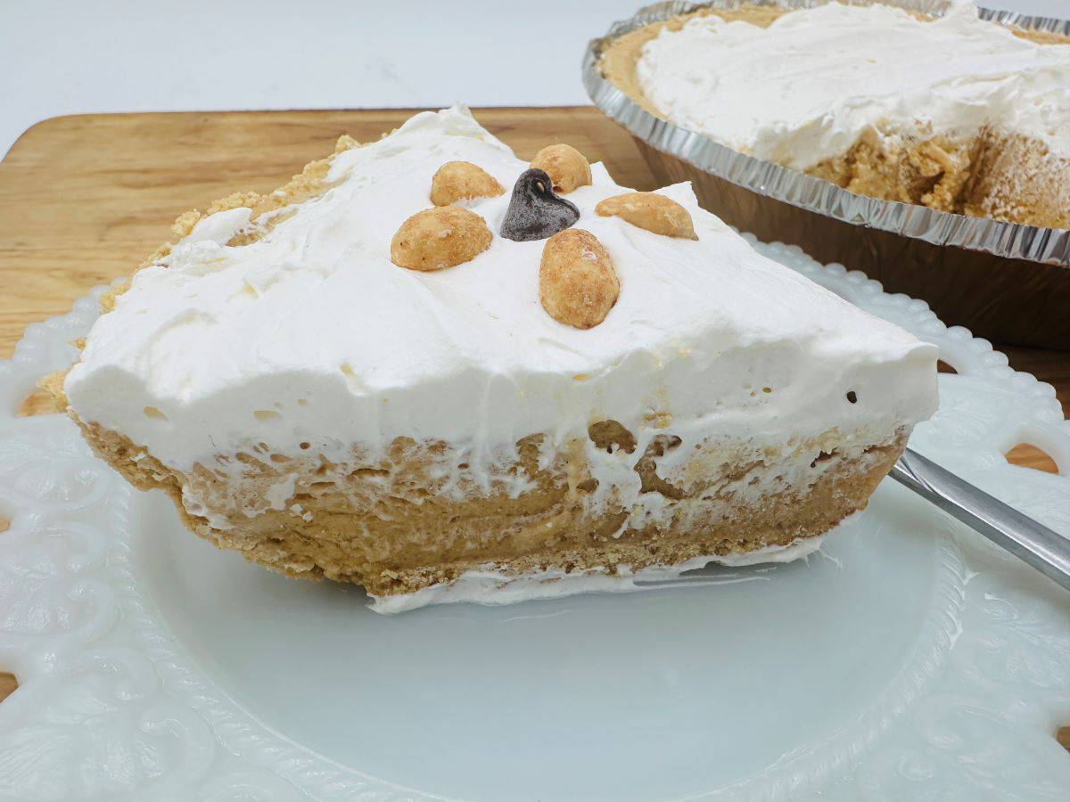 Slice of peanut butter pie on a plate.
