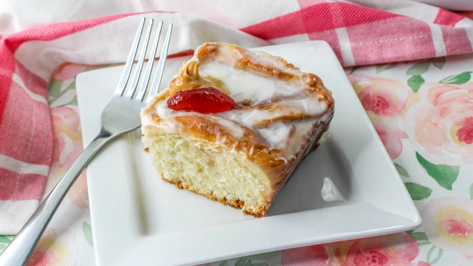 Piece of peanut butter and jelly rolls in a plate.