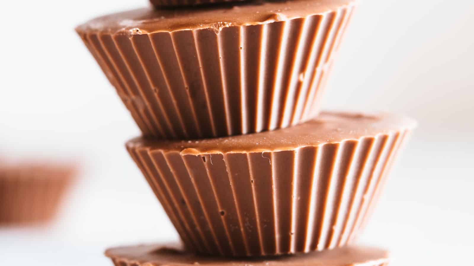 Two peanut butter cupcakes stacked on top of each.