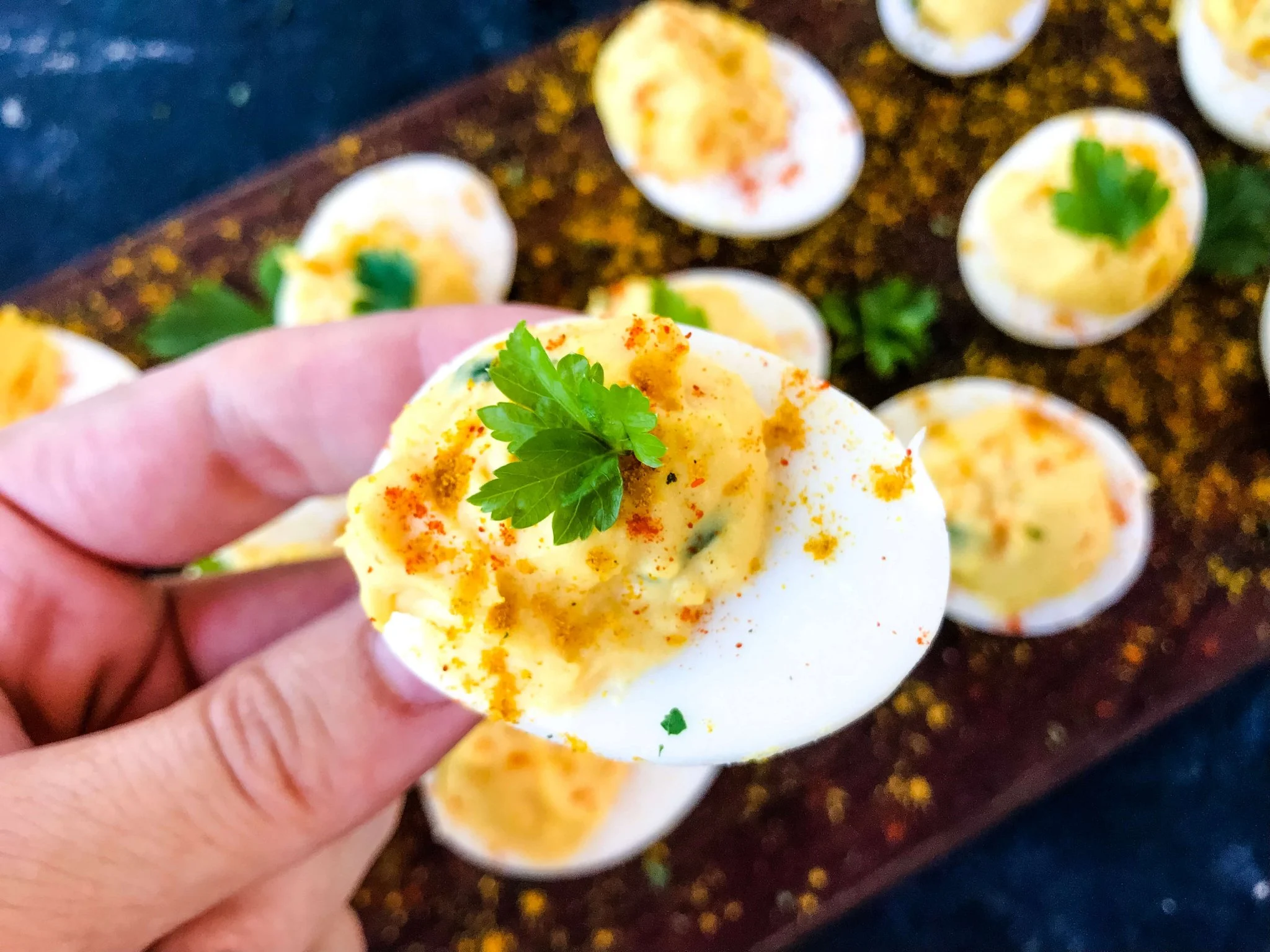 Football themed green plate with deviled eggs.