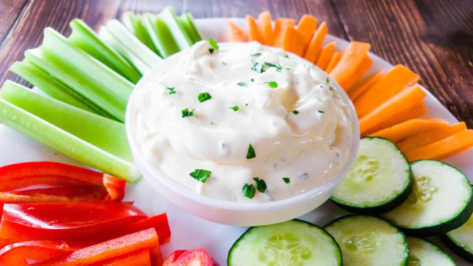 White bowl fillied with onion dip.
