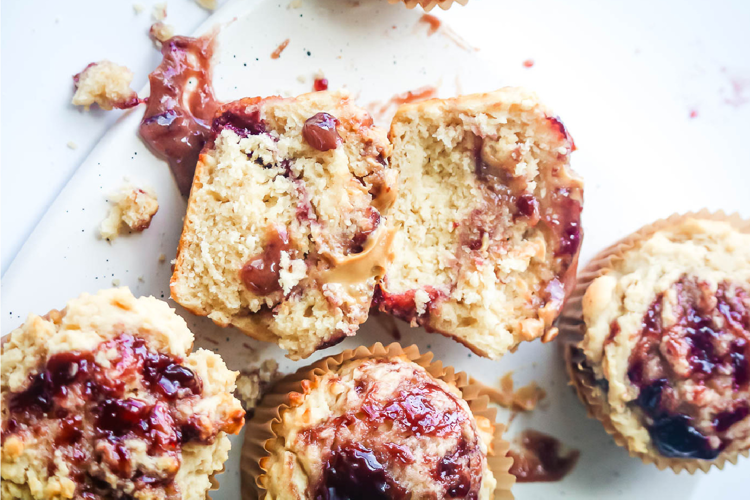 Peanut butter and jelly muffins on a counter.