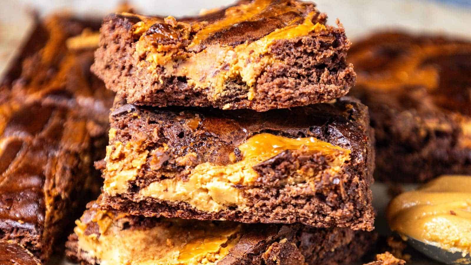 Peanut butter brownies stacked in a pyramid.
