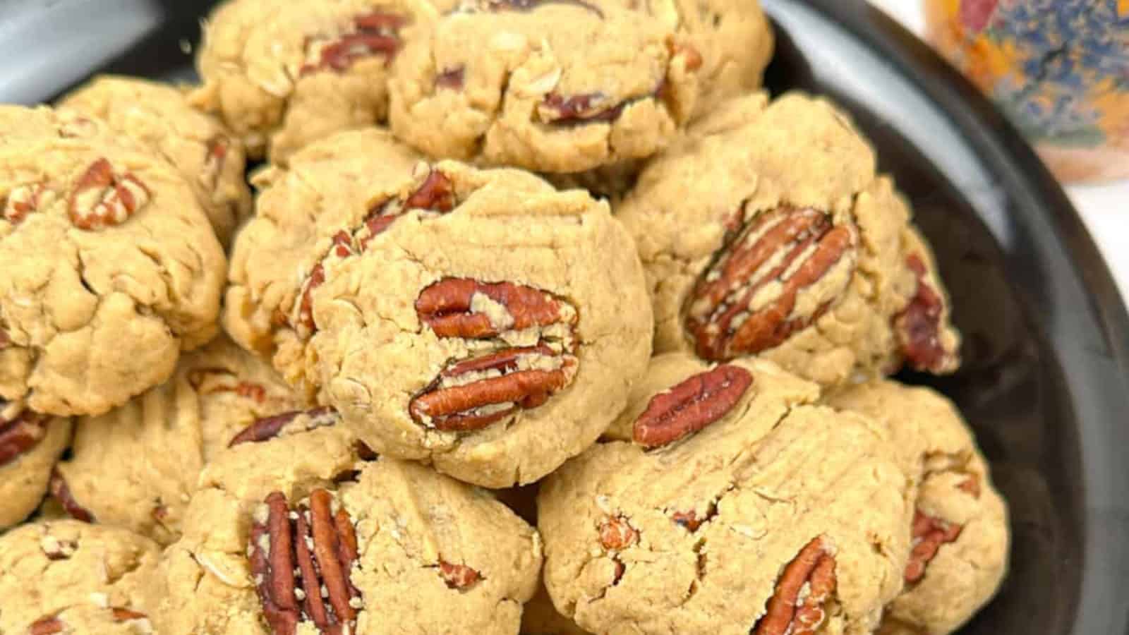 Peanut butter pecans cookies on a plate.