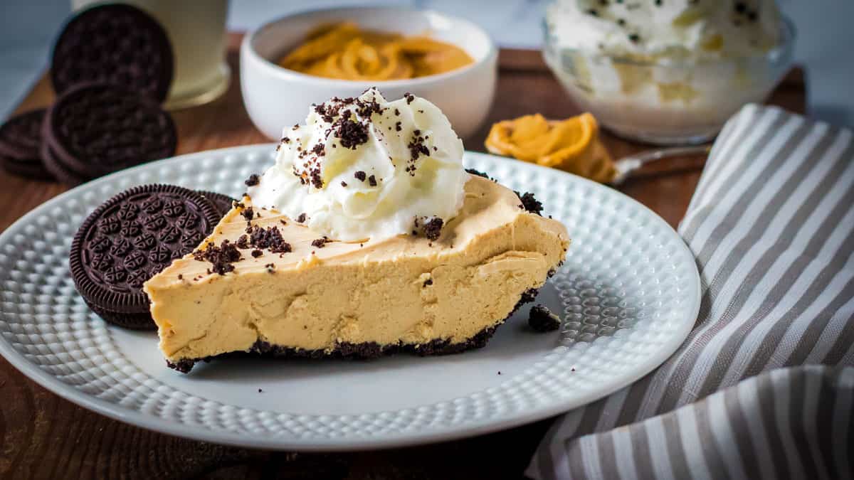 Slice of peanut butter pie on a plate.