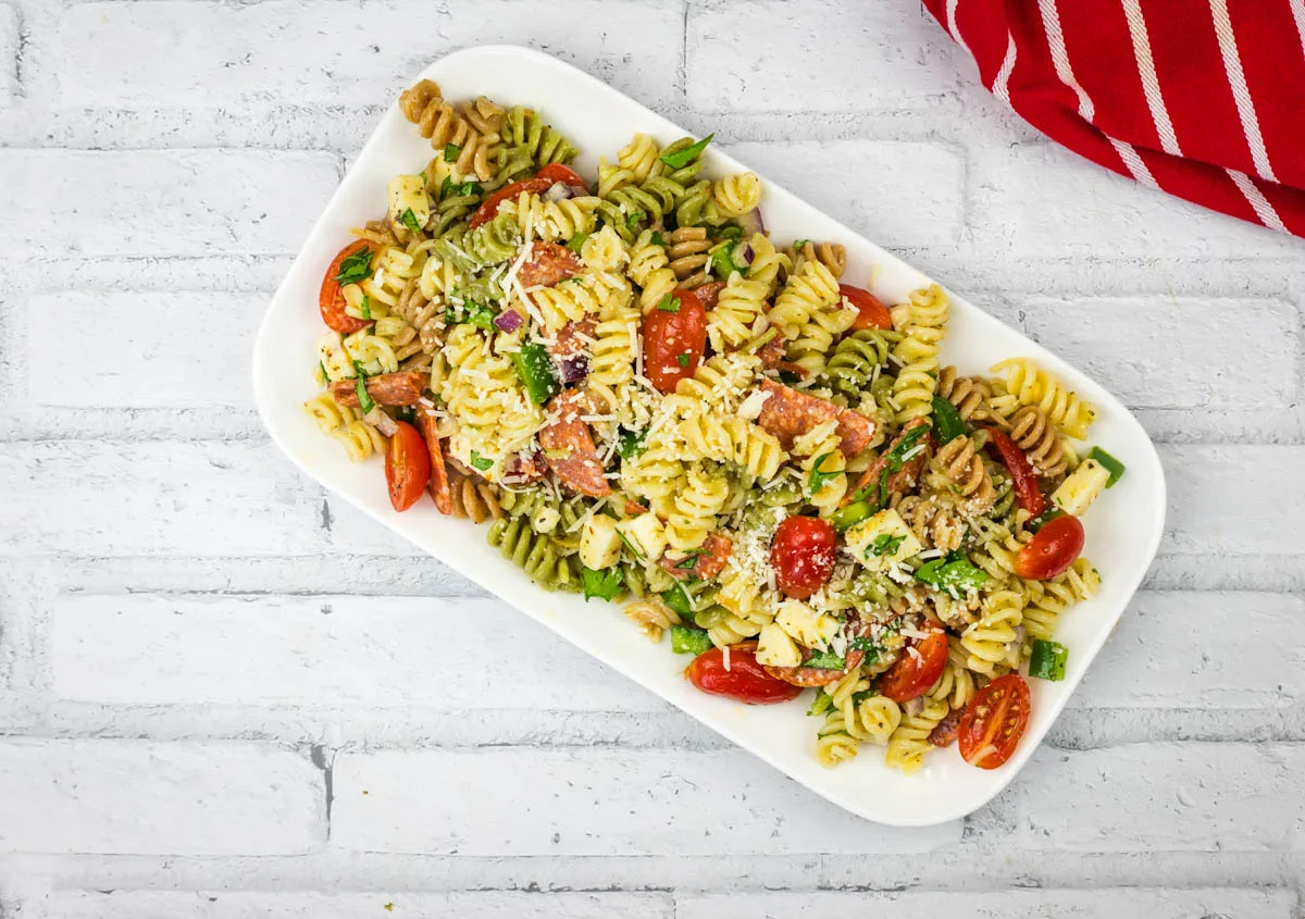 Pizza pasta salad in a rectangle serving platter.