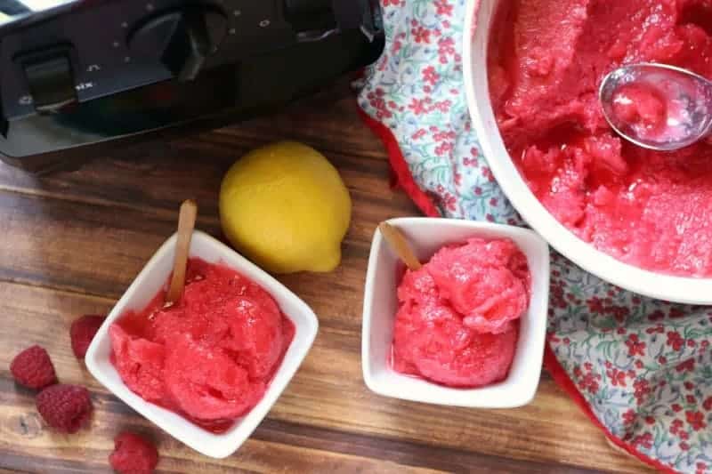 Raspberry lemonade sorbet in small white bowls.