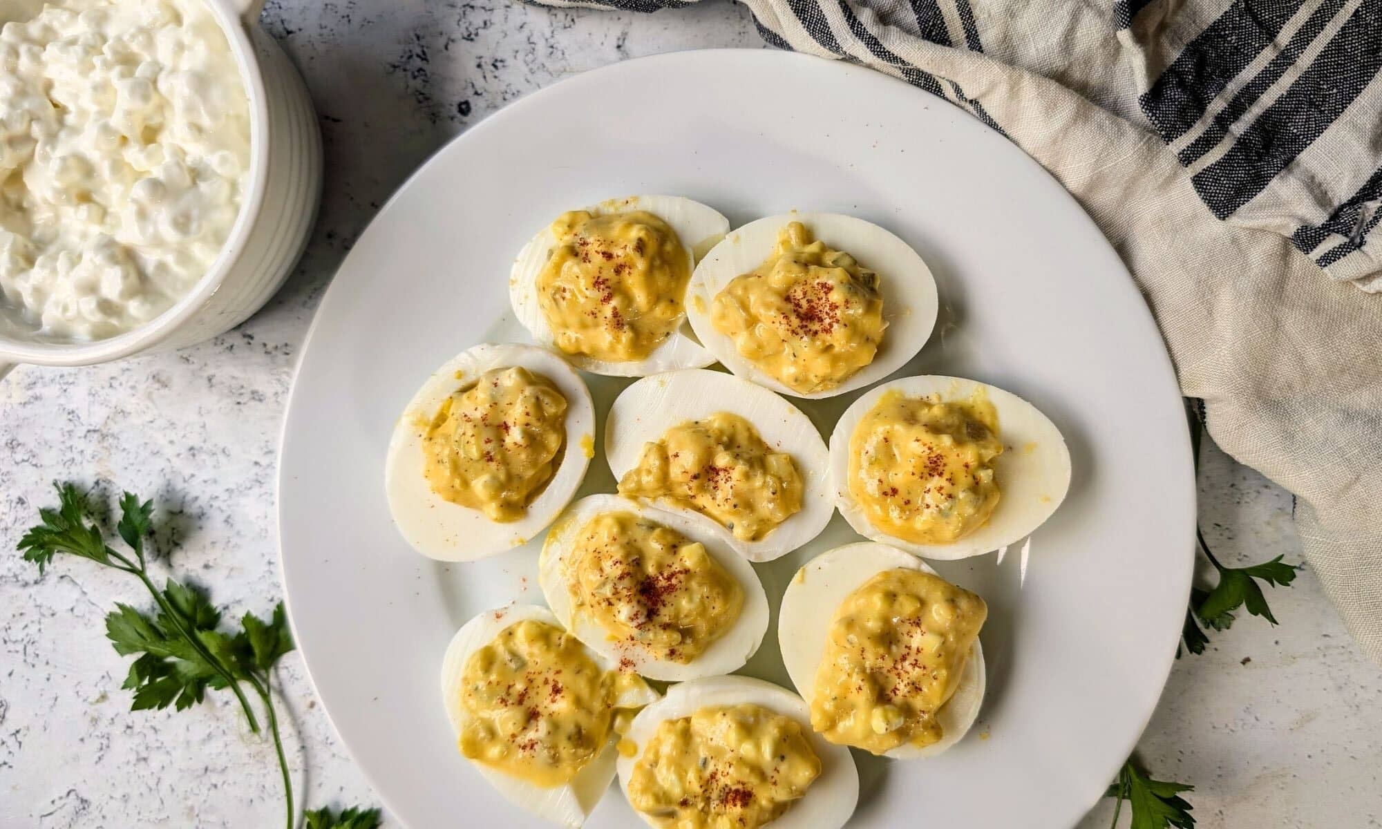 Devield eggs on a white plate.