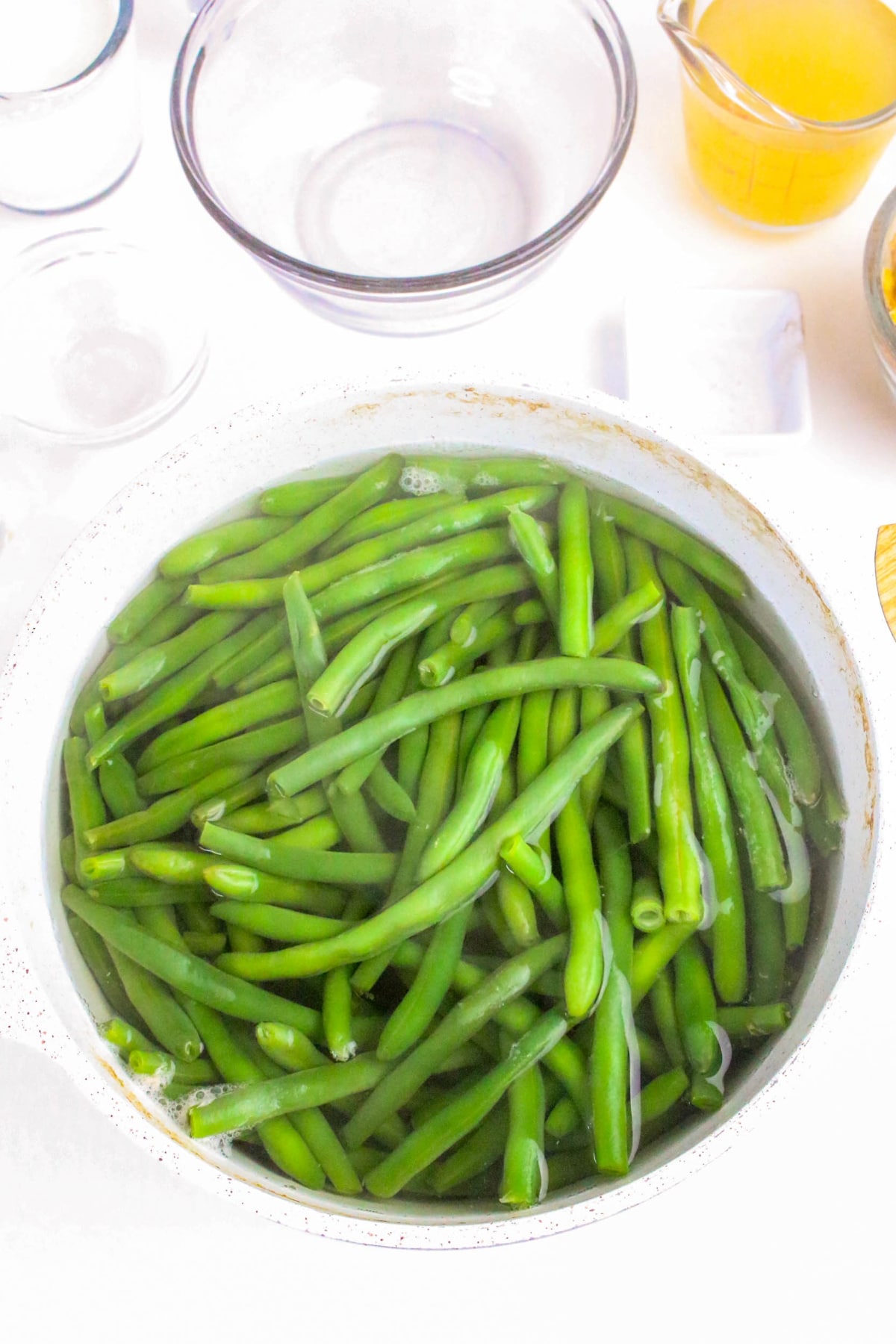 Cooked fresh green beans in a stock pot.