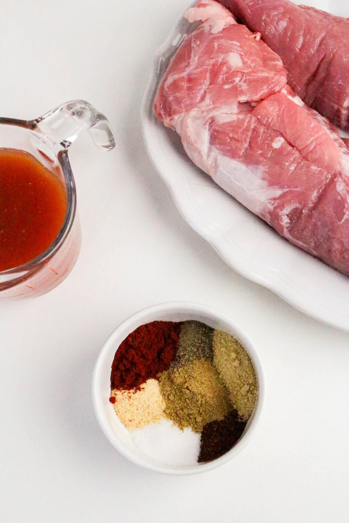 A mix of spices in a small white bowl.